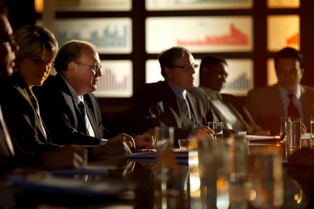 Members of an executive board sitting around a table.