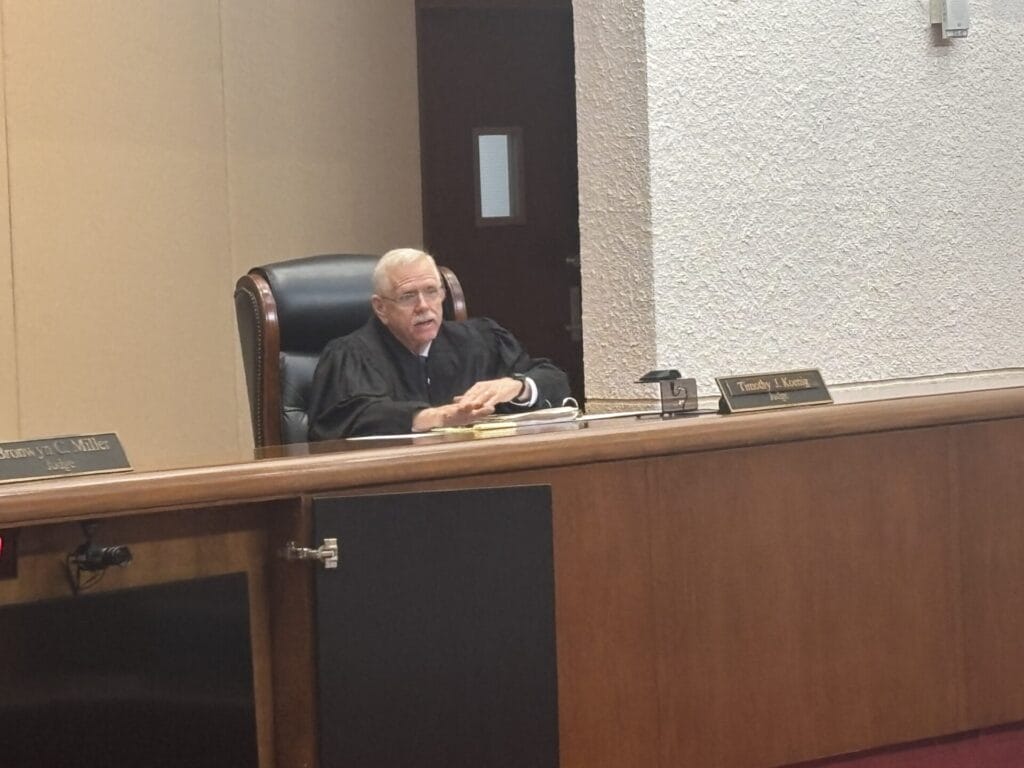Judge Timothy Koenig sitting at the bench with the Third District Court of Appeals of Florida.